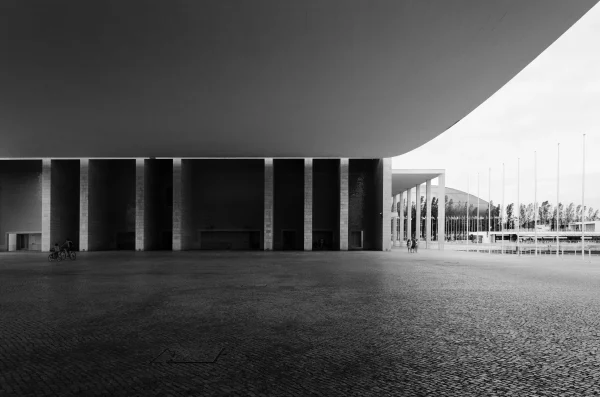 Architecture photography of Álvaro Siza’s Portugal Pavilion in Lisbon, highlighting its suspended concrete canopy, by Plem Visual Tales